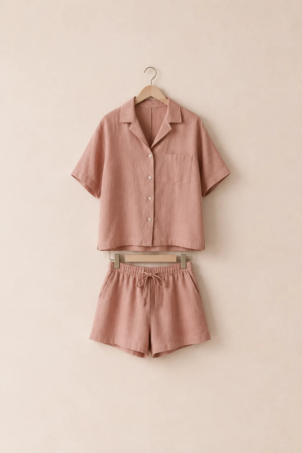 Dusty rose linen-blend boxy shirt and matching drawstring shorts on hangers