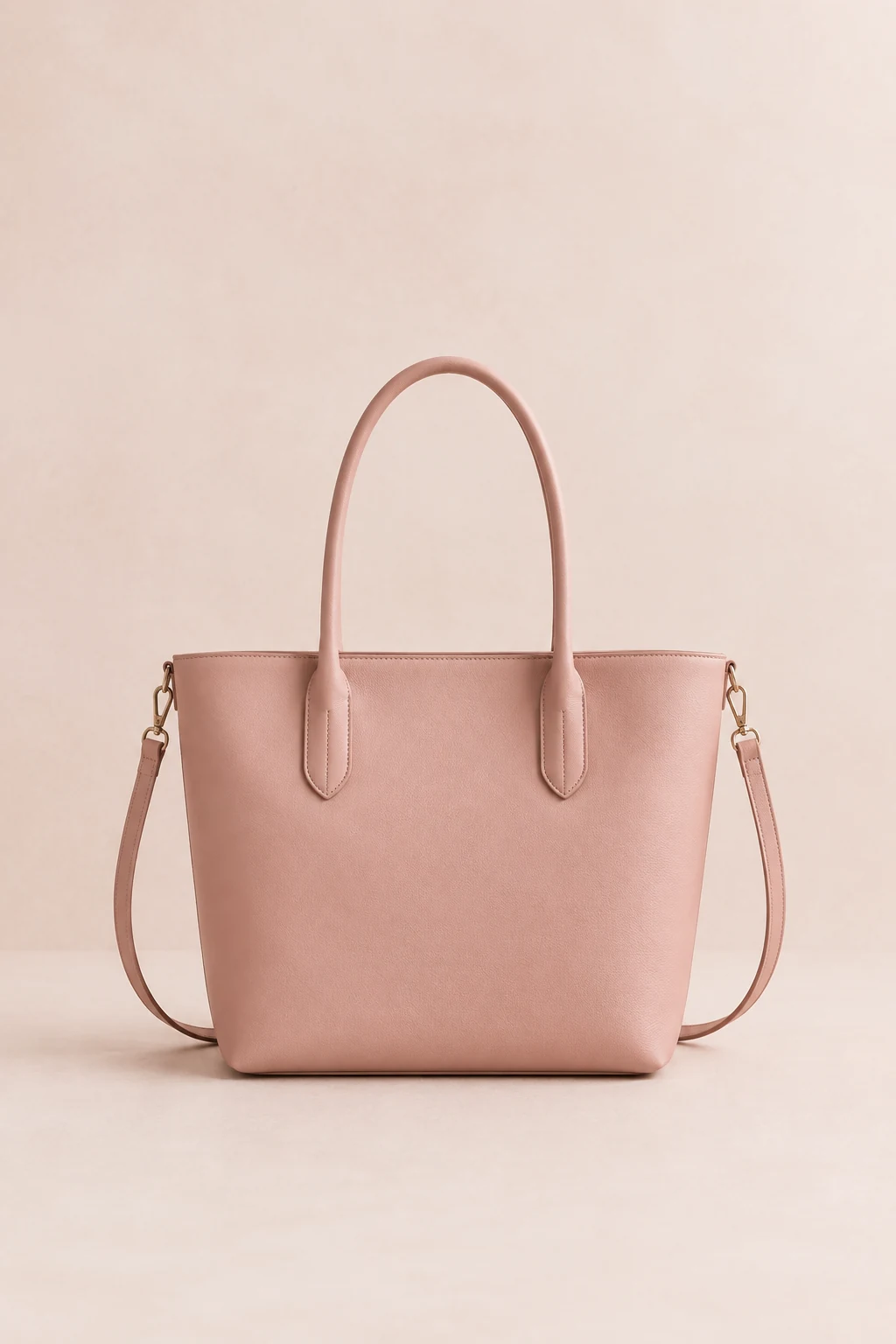 Structured blush tote bag with two top handles standing upright